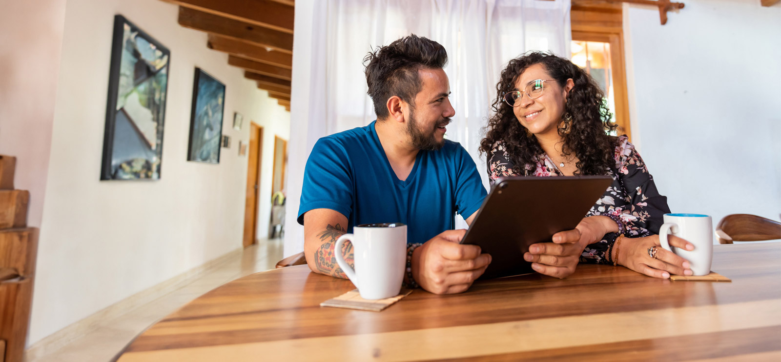 Young couple going over finances in kitchen
